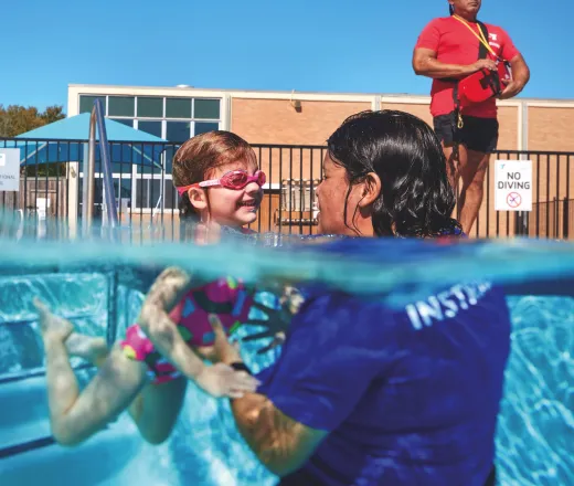 Child receiving swim lessons at the YMCA